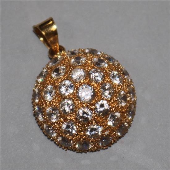 A paste-set yellow metal convex disc-shaped pendant (suspension bale marked 21K)